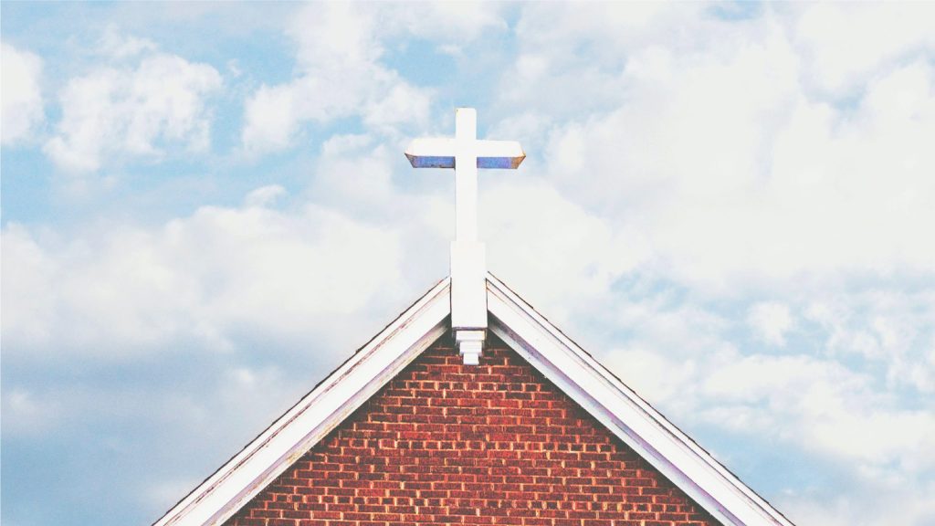 Cross on brick church